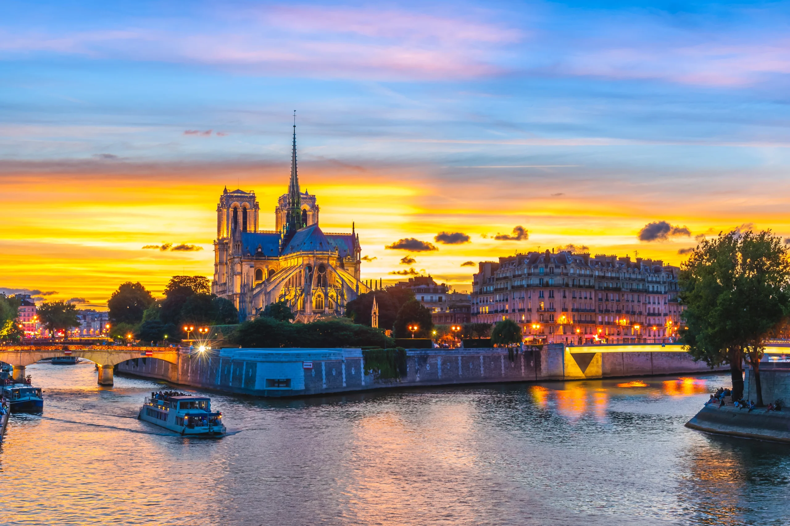 Sunset river Seine cruise going past Notre-Dame during Private Paris guided tour