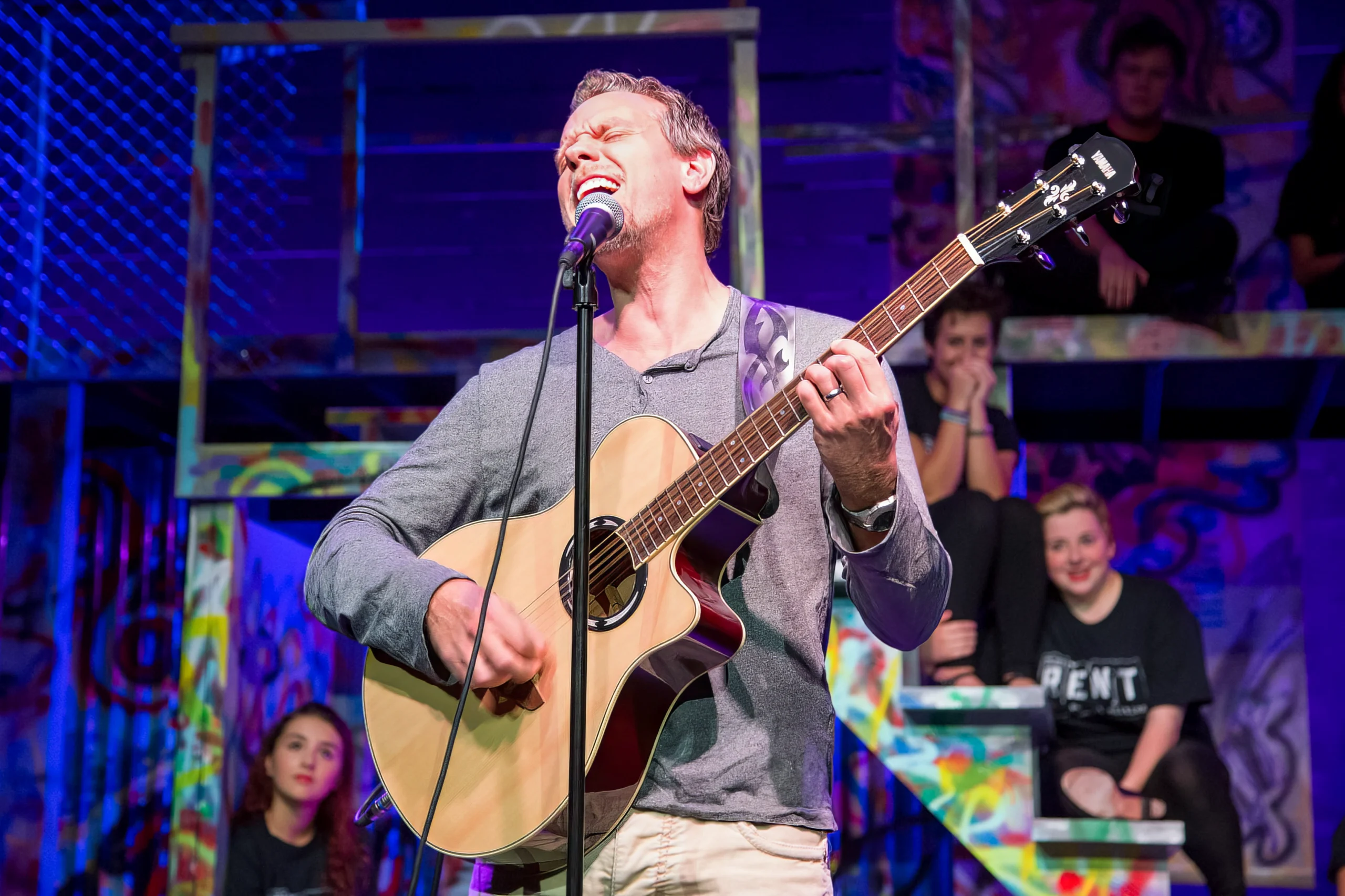 Adam Pascal performing during showcase concert