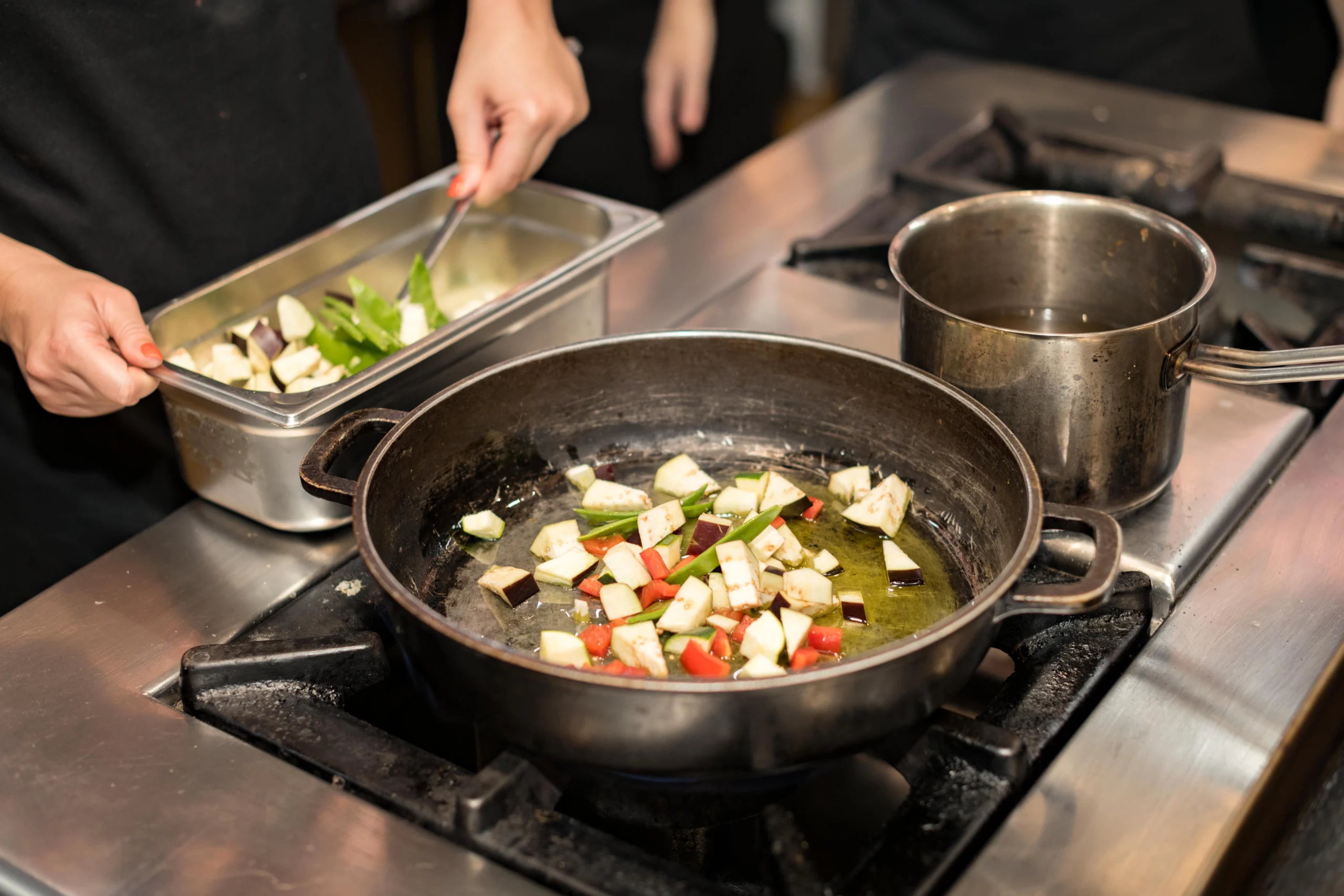 Close up of dish being cooked over the stove Barcelona Cooking Class for Social Good