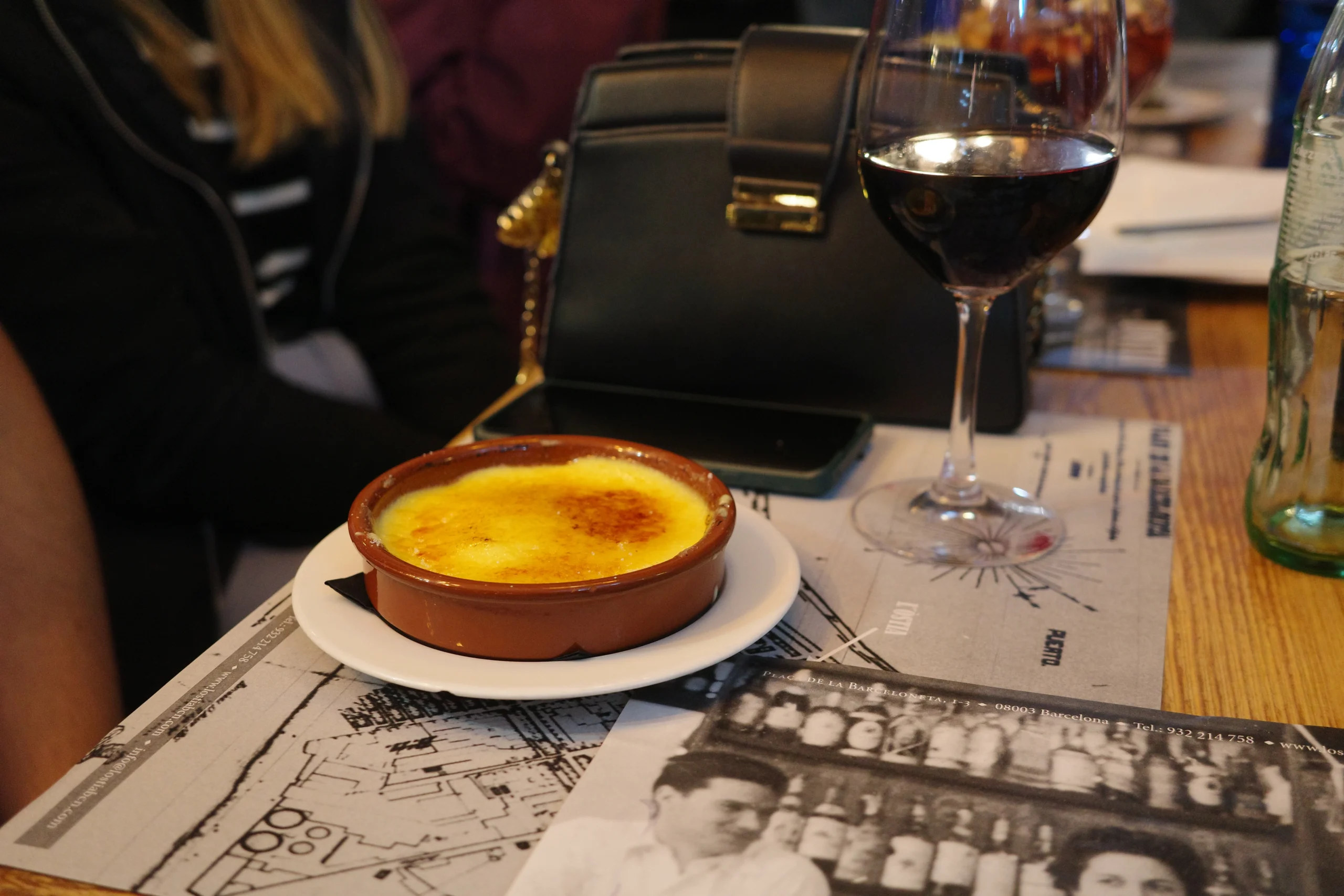 Crema Catalana and glass of wine during Barceloneta Tapas Experience