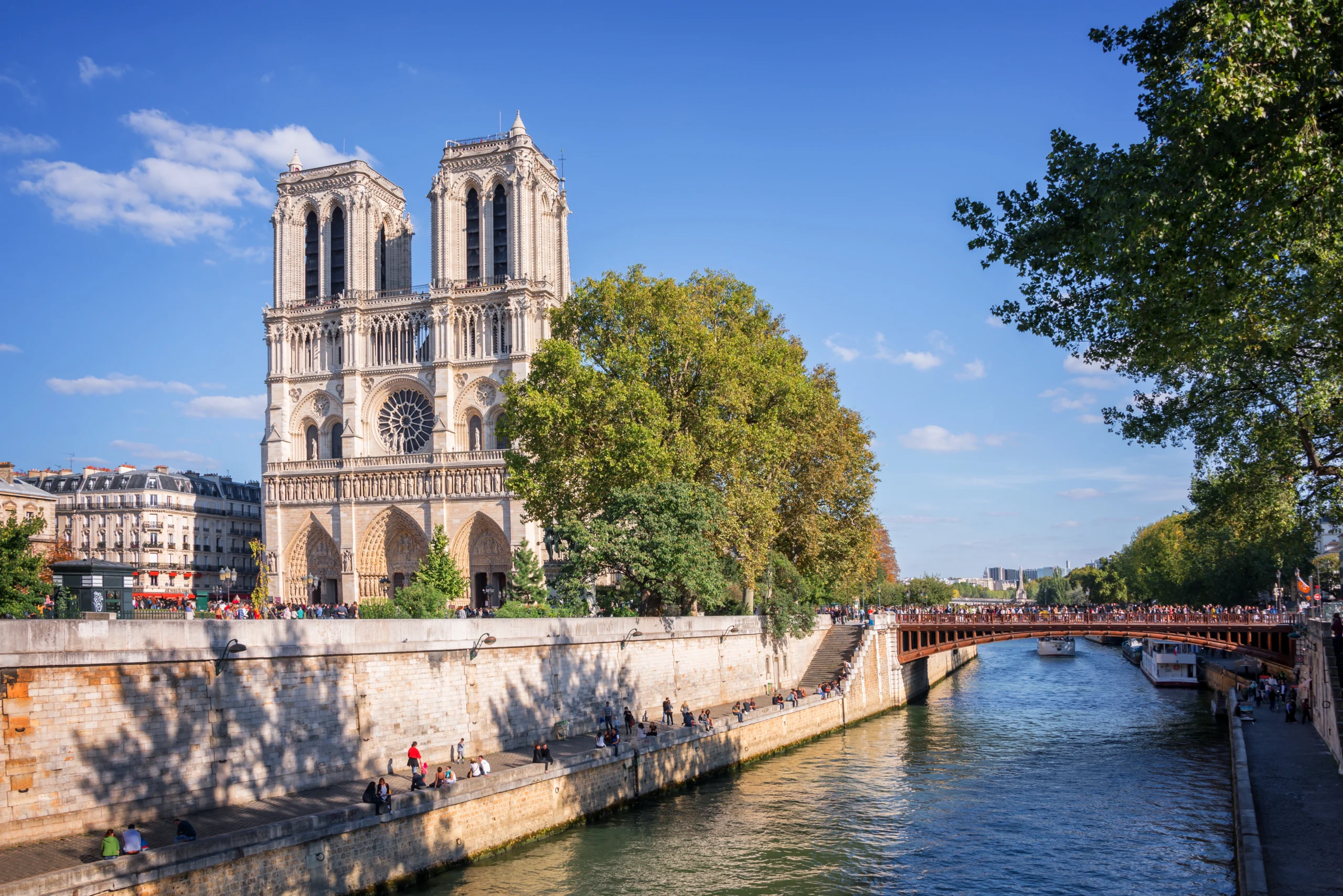 Facade of Notre Dame de Paris and the river Seine