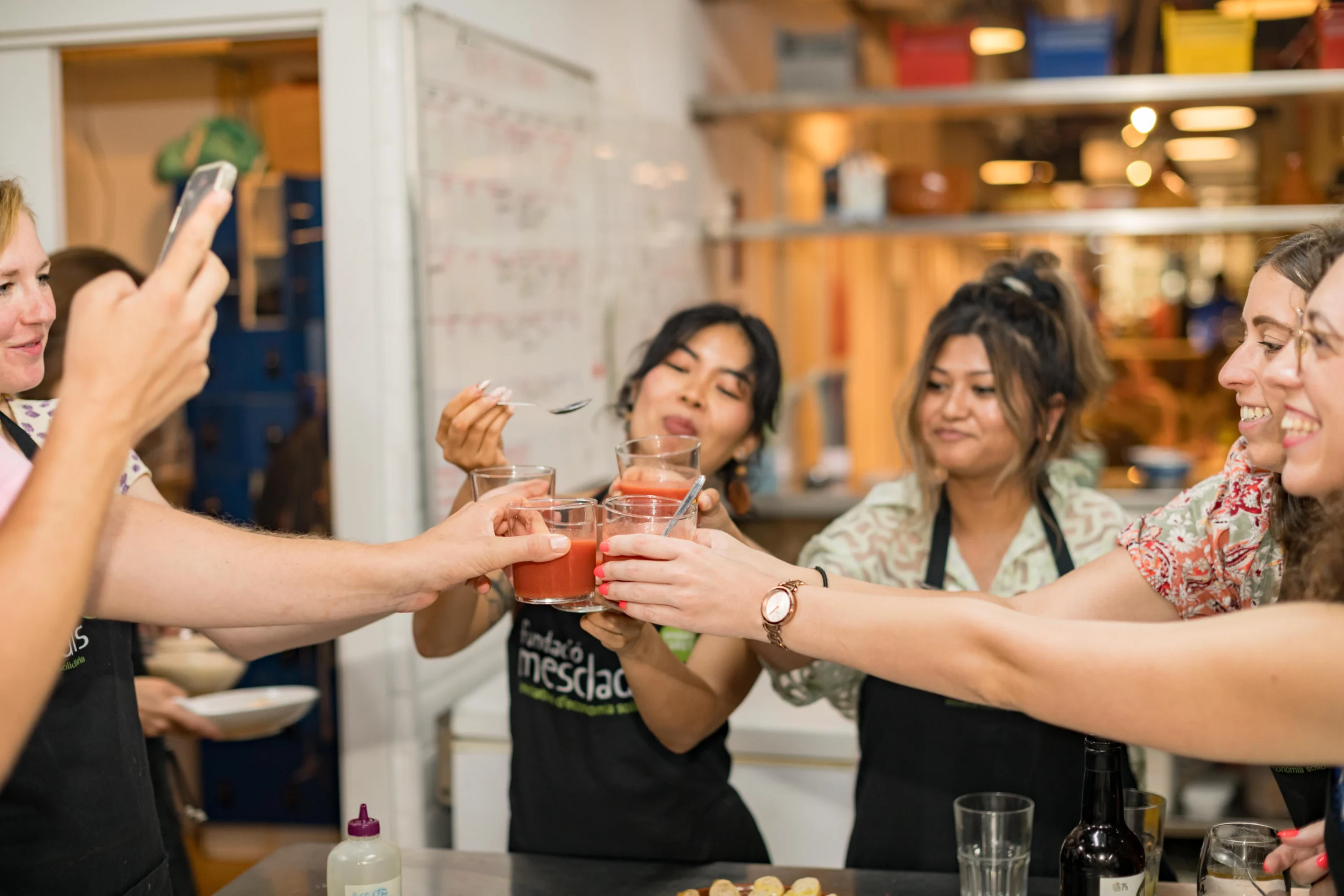 Guests cheering drinks during Barcelona Cooking Class for Social Good