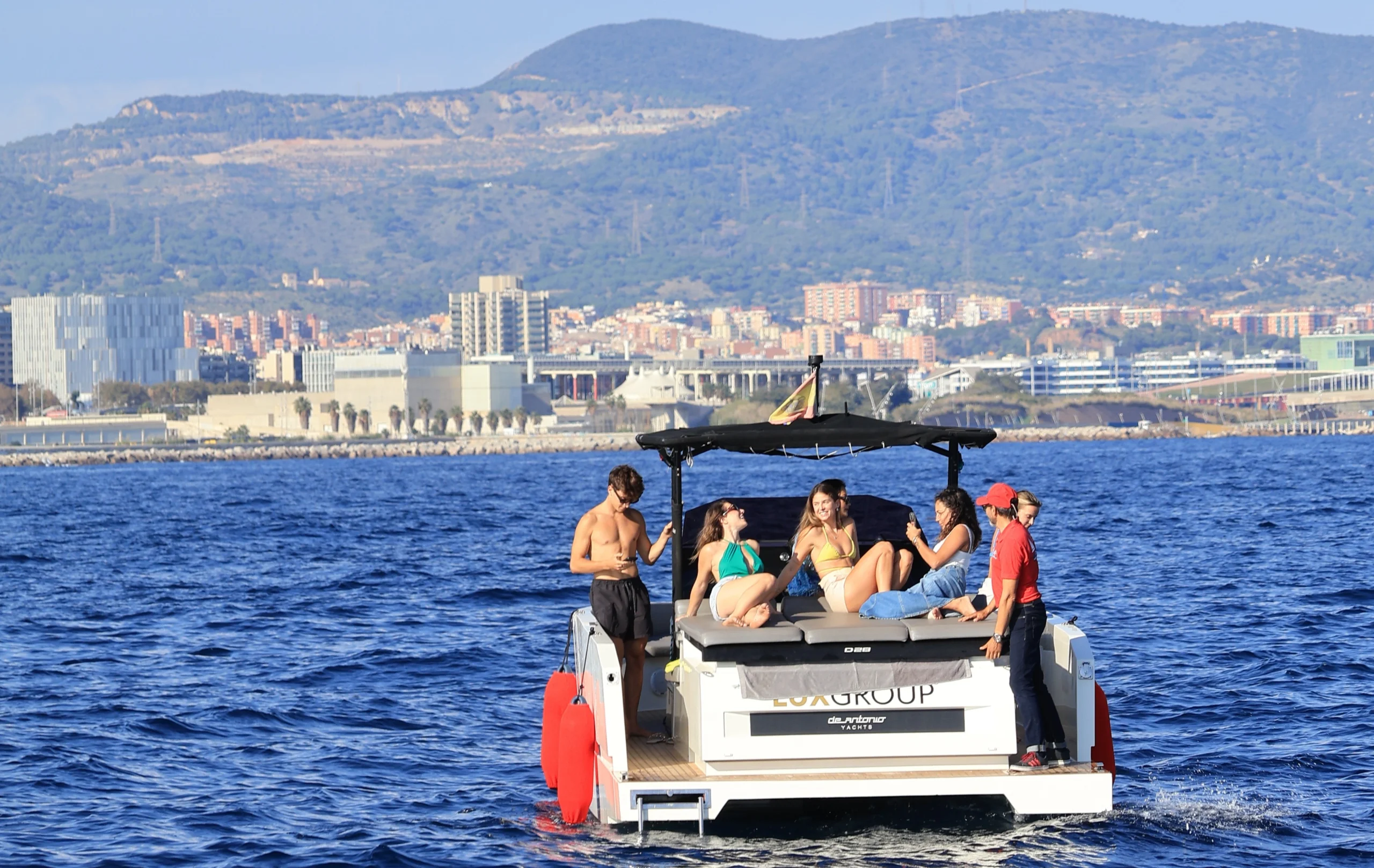 Guests enjoying on the motorboat during Sitges Sailing Tour