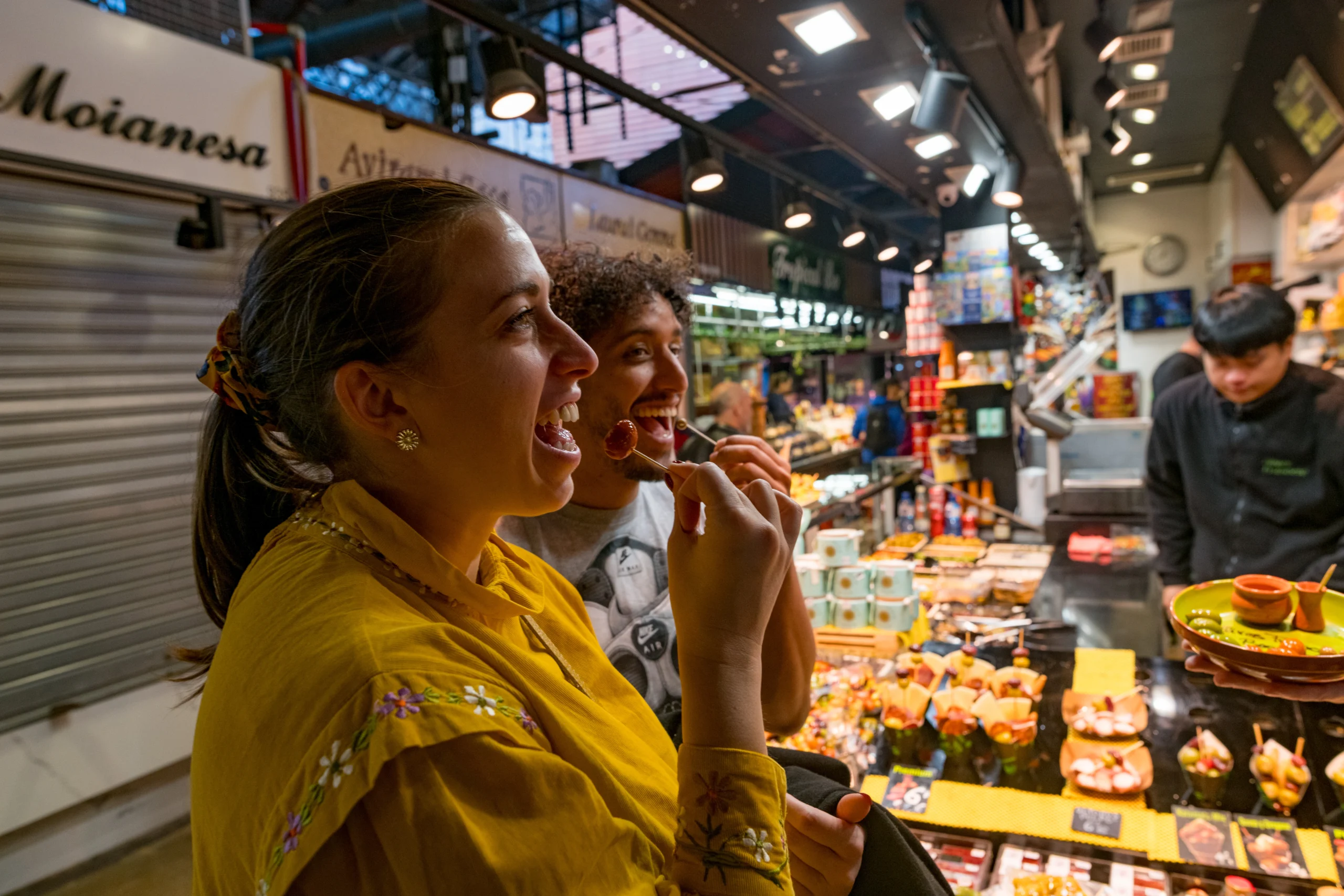 Guests enjoying samples in St Josep La Boqueria