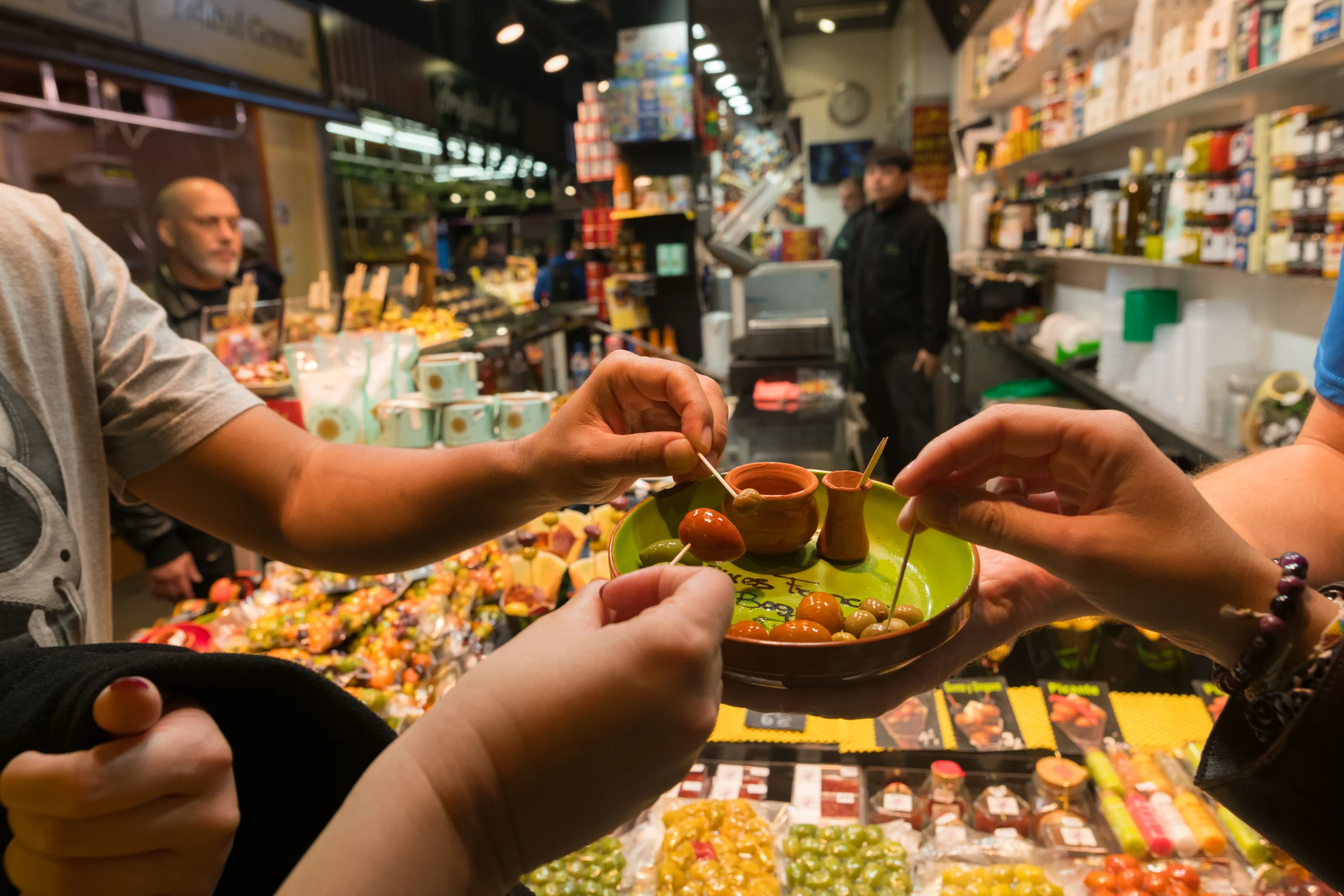 Guests sampling olives during premium Barcelona Markets experience