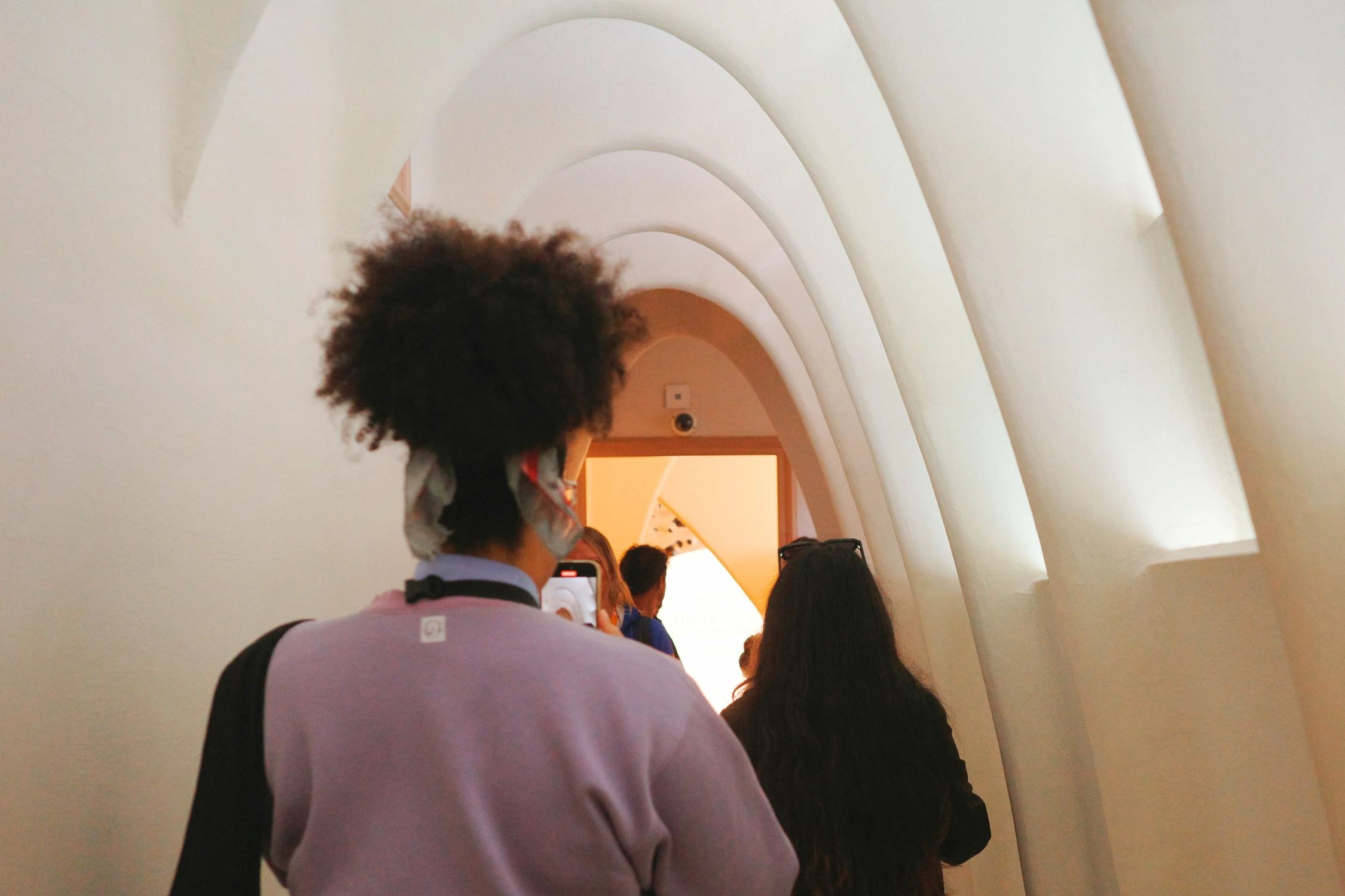 Guests walking through hallway in Casa Batllo in Barcelona