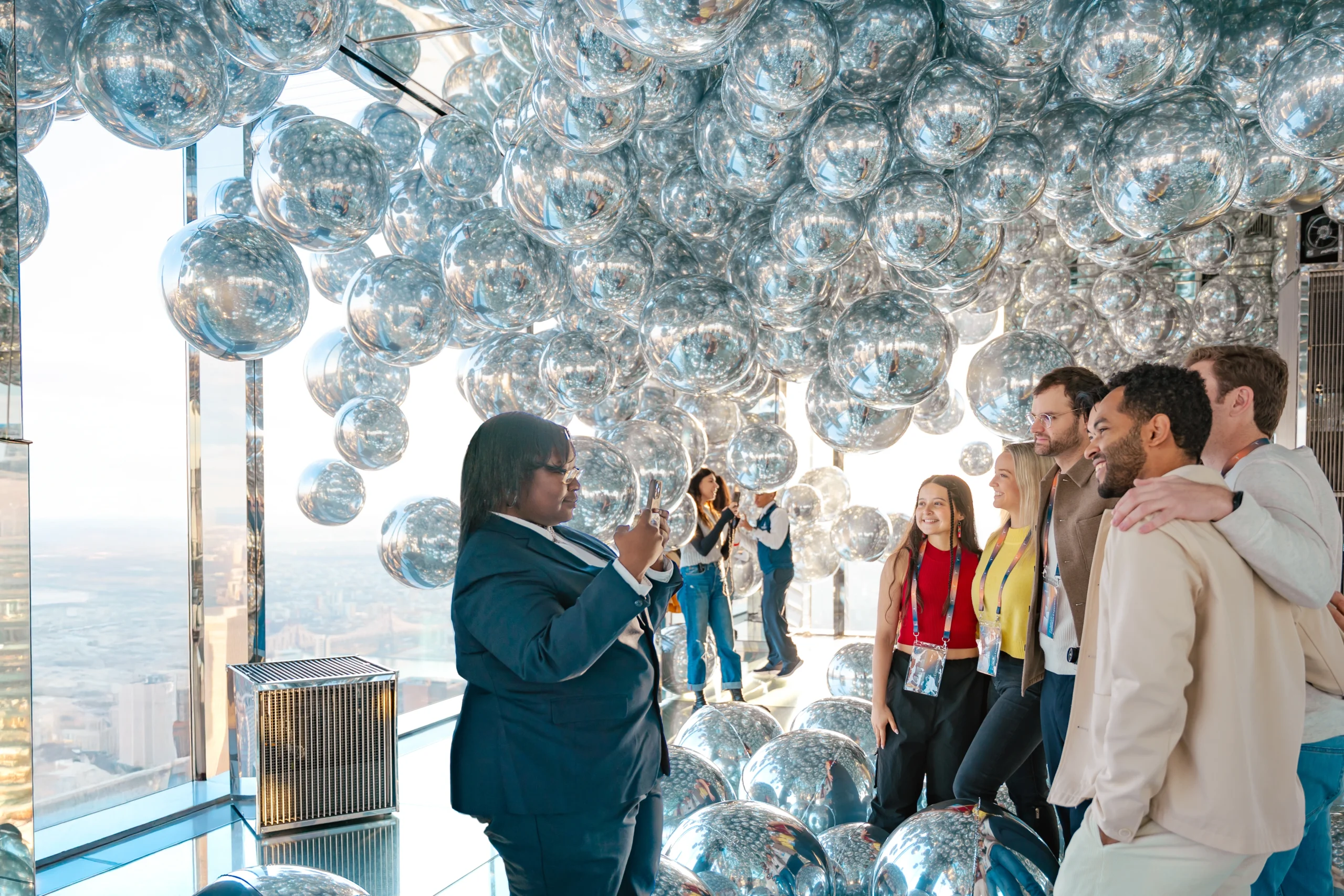 Guide taking photo of guests at The Summit One Vanderbilt in NYC