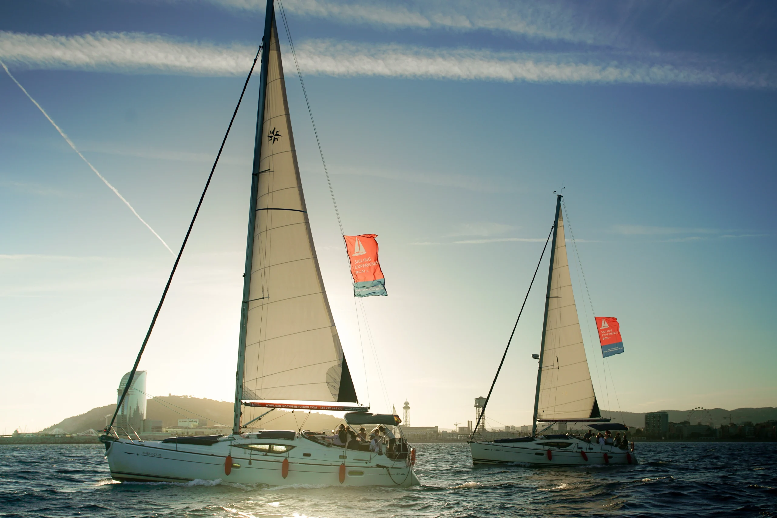Luxury sailing yachts at sea during Barcelona sunset sailing experience