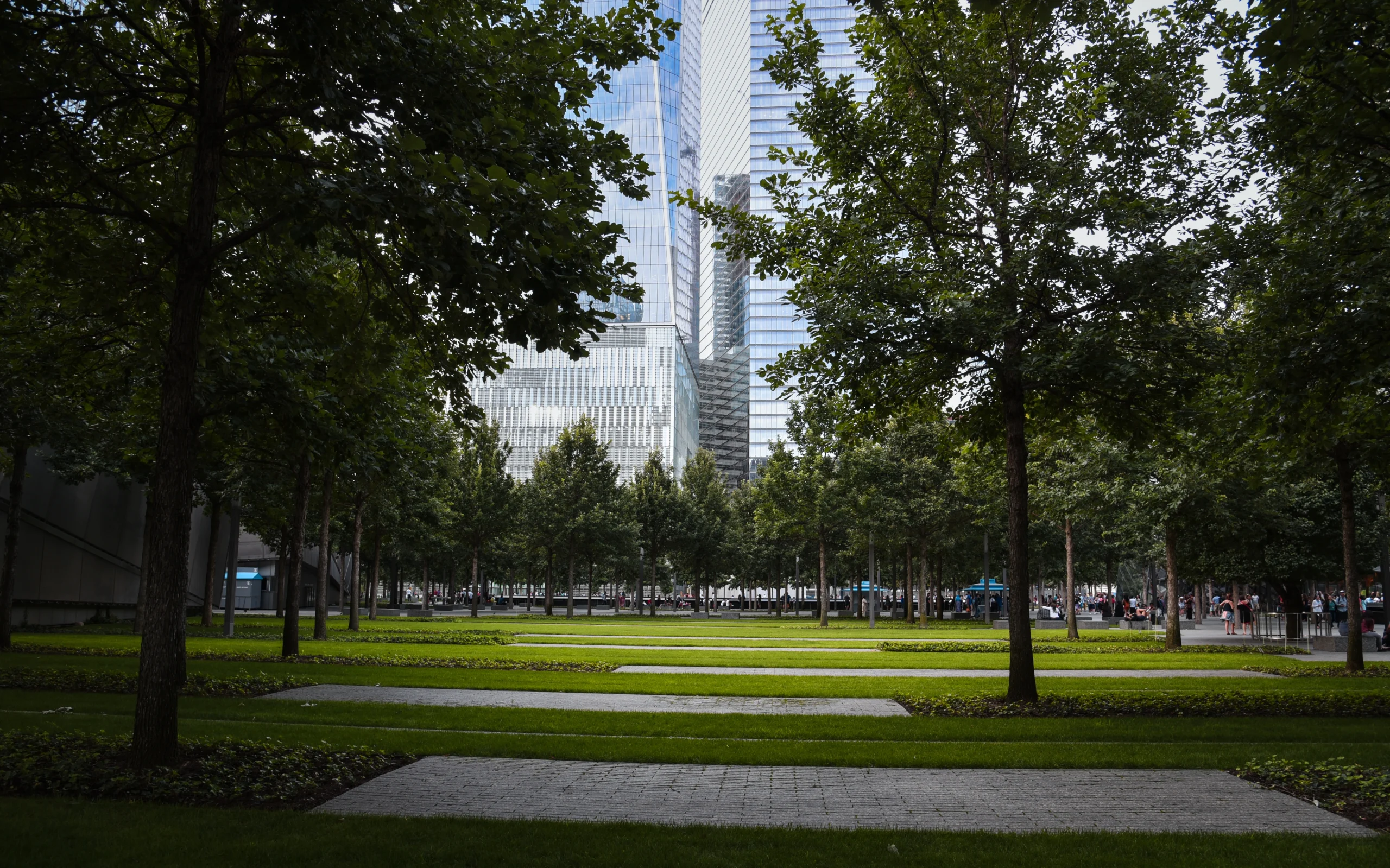 Park outside the National September 11 Memorial and Museum with the One World Trade Center in the Background - Manhattan, New York City