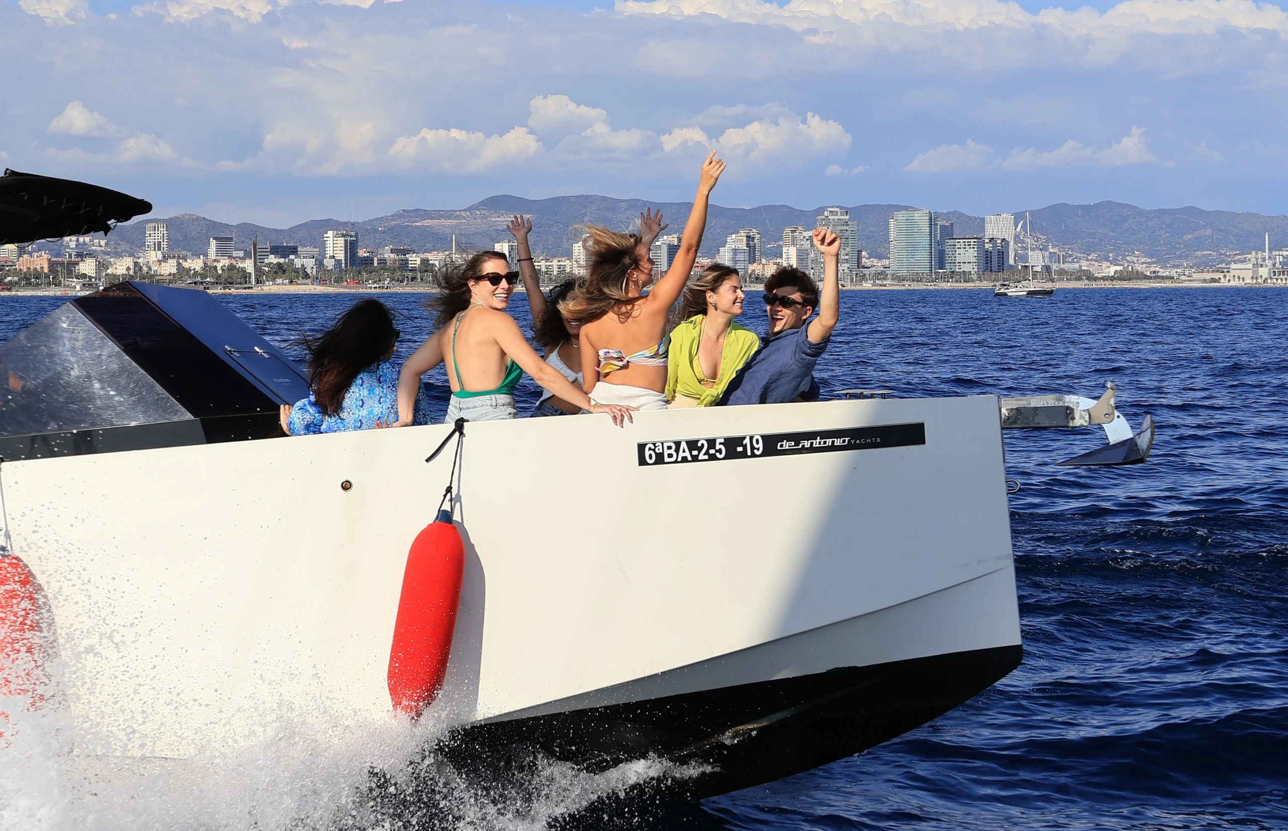 Side view of high-end motorboat during Sitges Sailing Tour