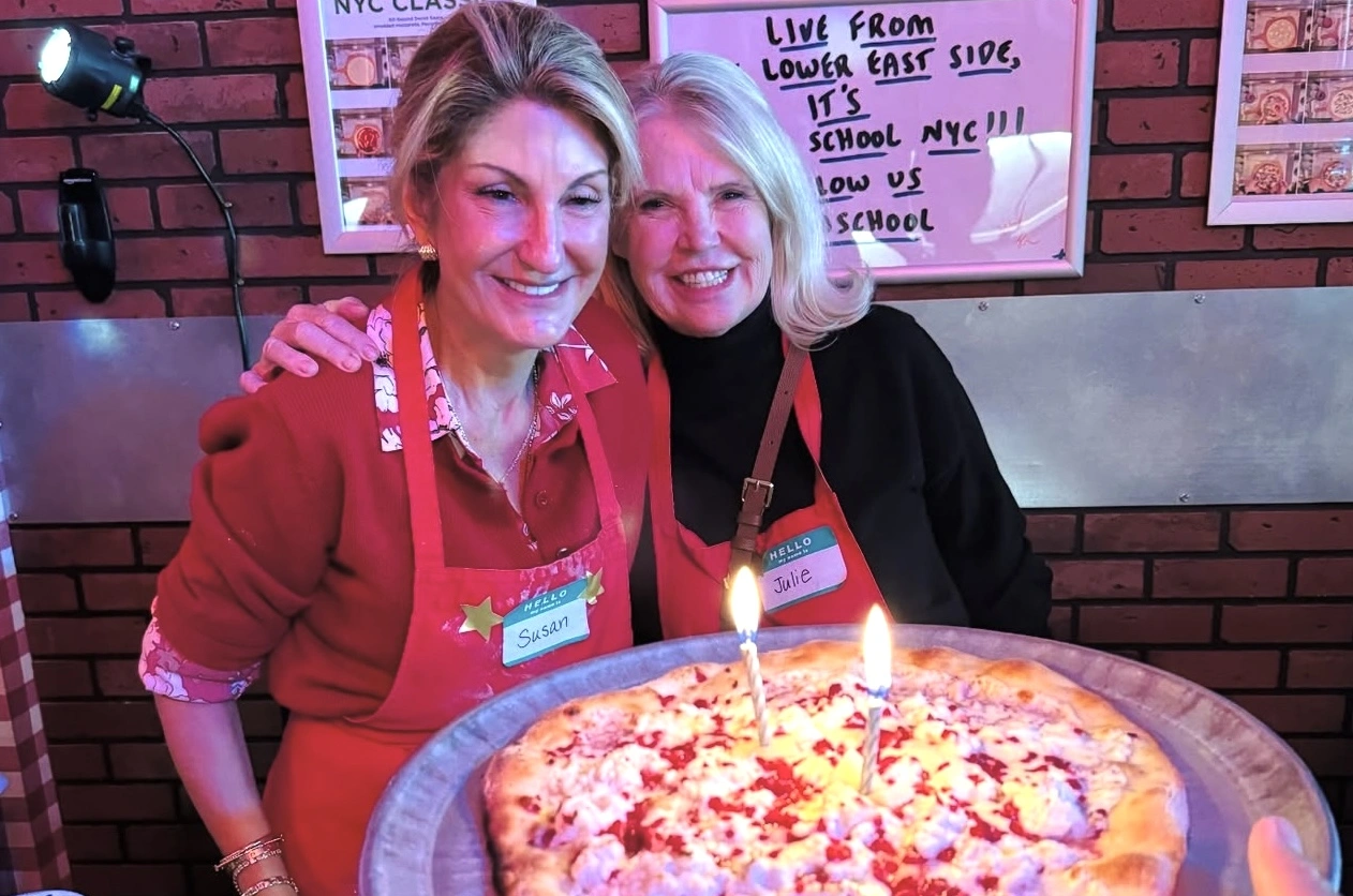 Two women with ther pizza during Pizza-Making Workshop in New York City
