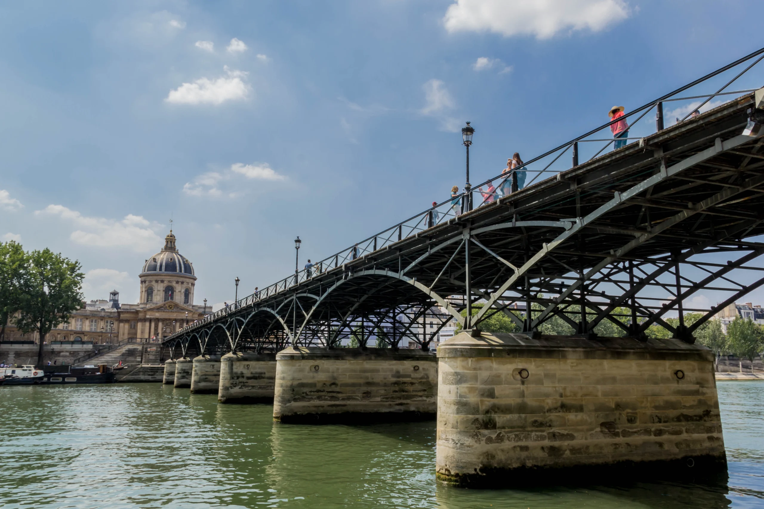 View of Pont des Arts bridge in Paris during guided Seine experience