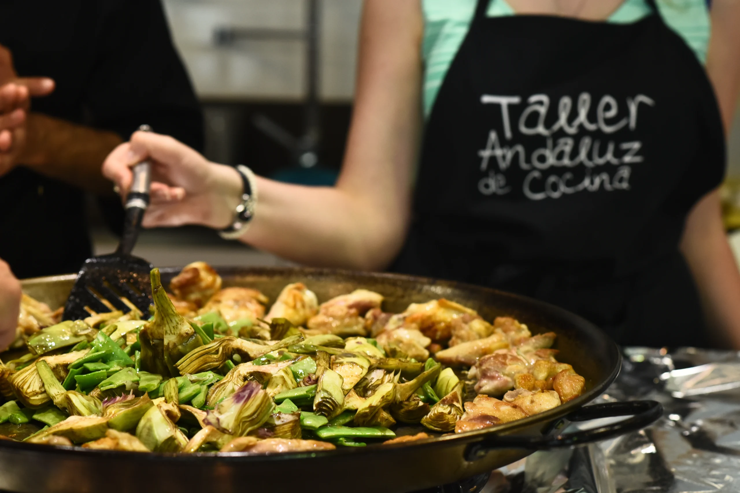 Close up of food being pooked in paella pan