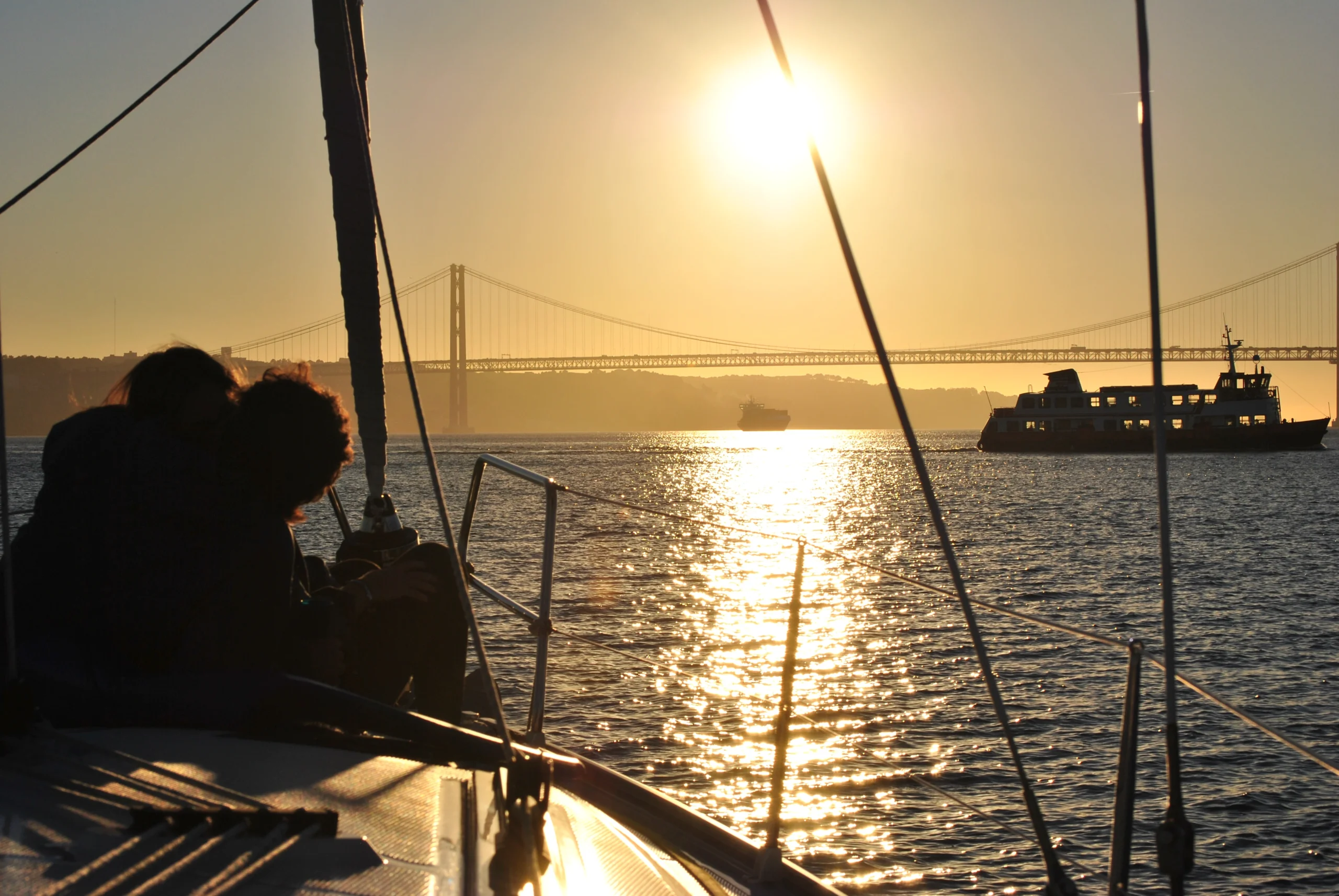 Golden hour on the private yacht during Sunset Sail experience in Lisbon