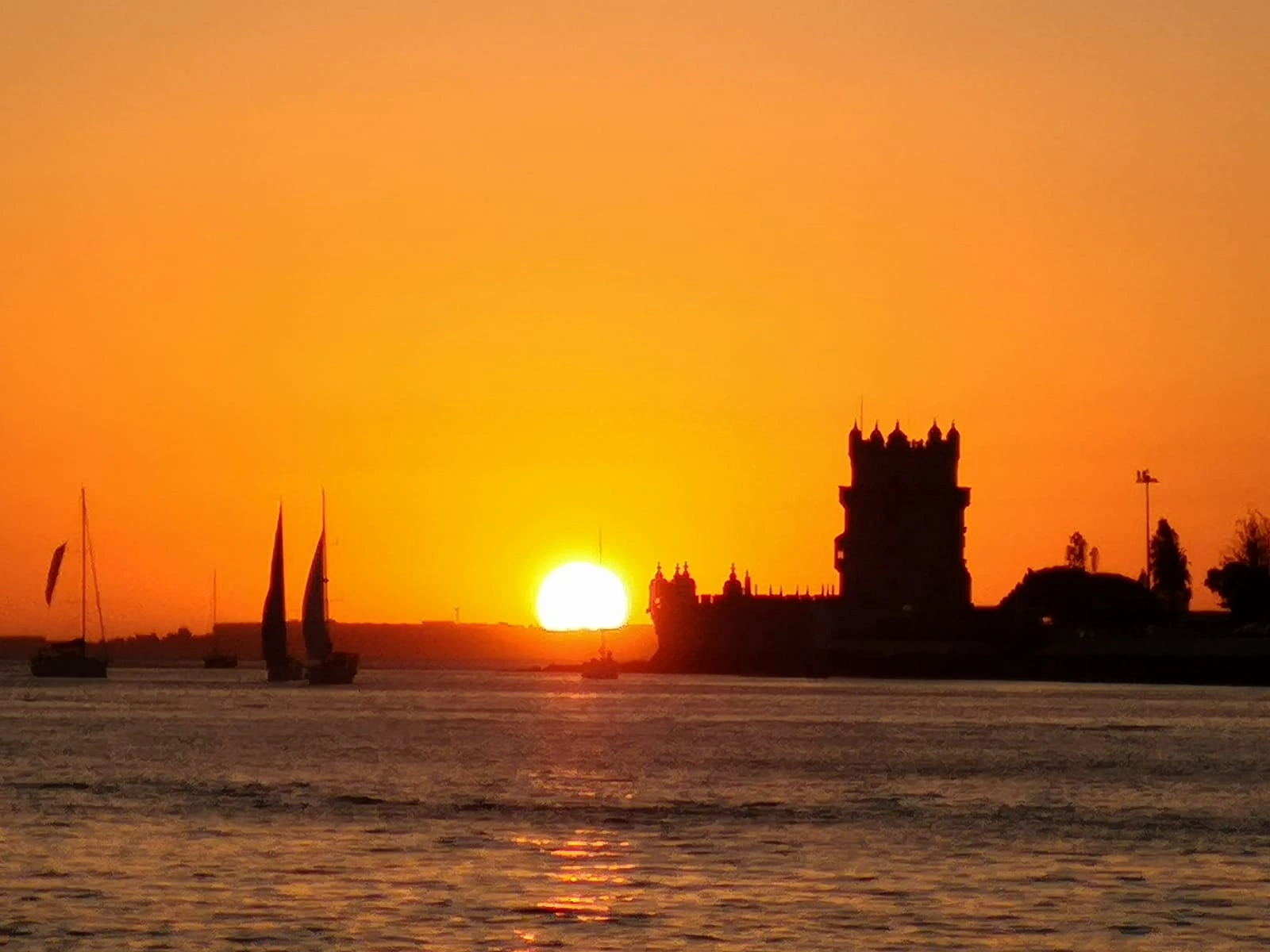 Golden hour view in the water during Sunset Sail in Lisbon