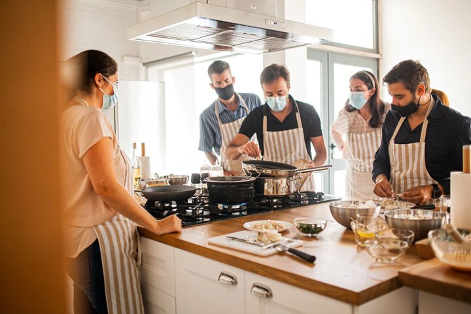 Guests and host during Pastel de Nata Baking Experience in Lisbon