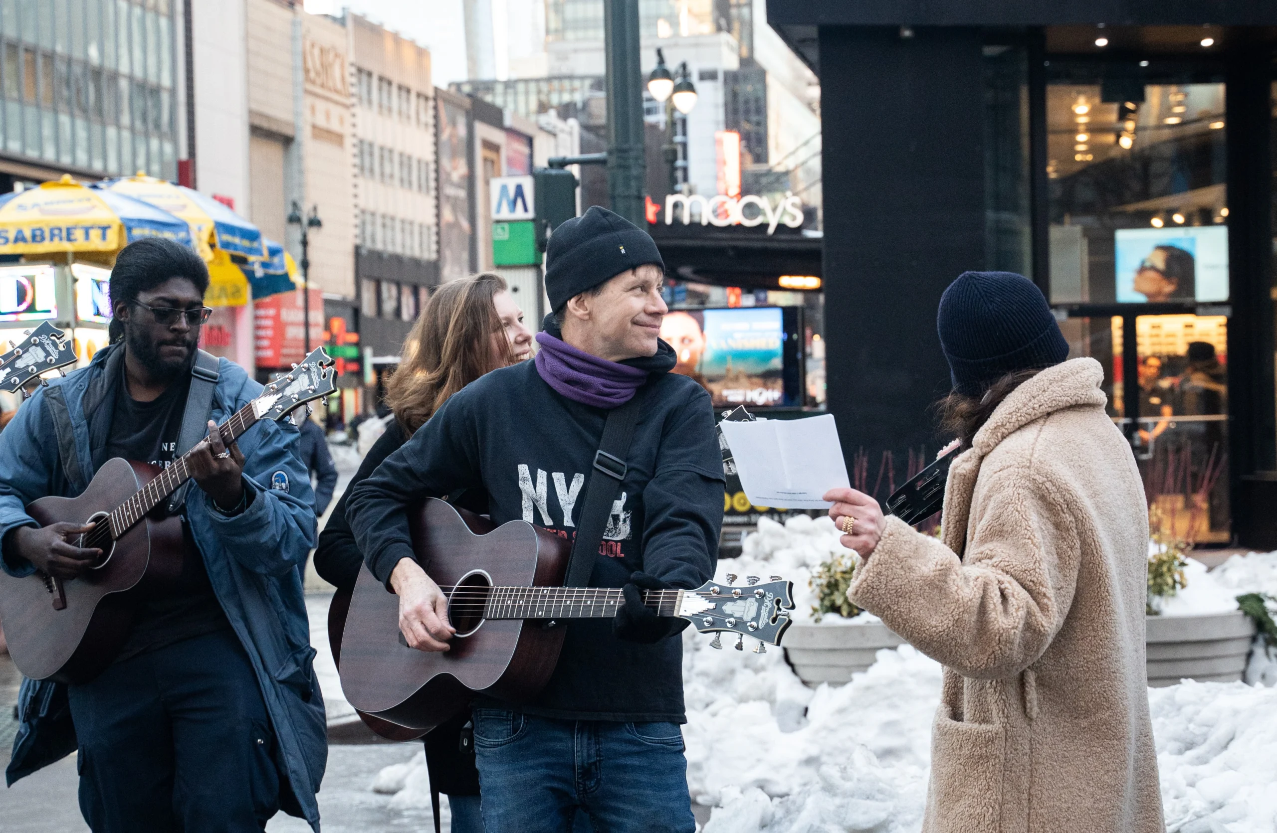 Guests and teacher busking near Broadway NYC during Guitar Workshop and Busking Experience
