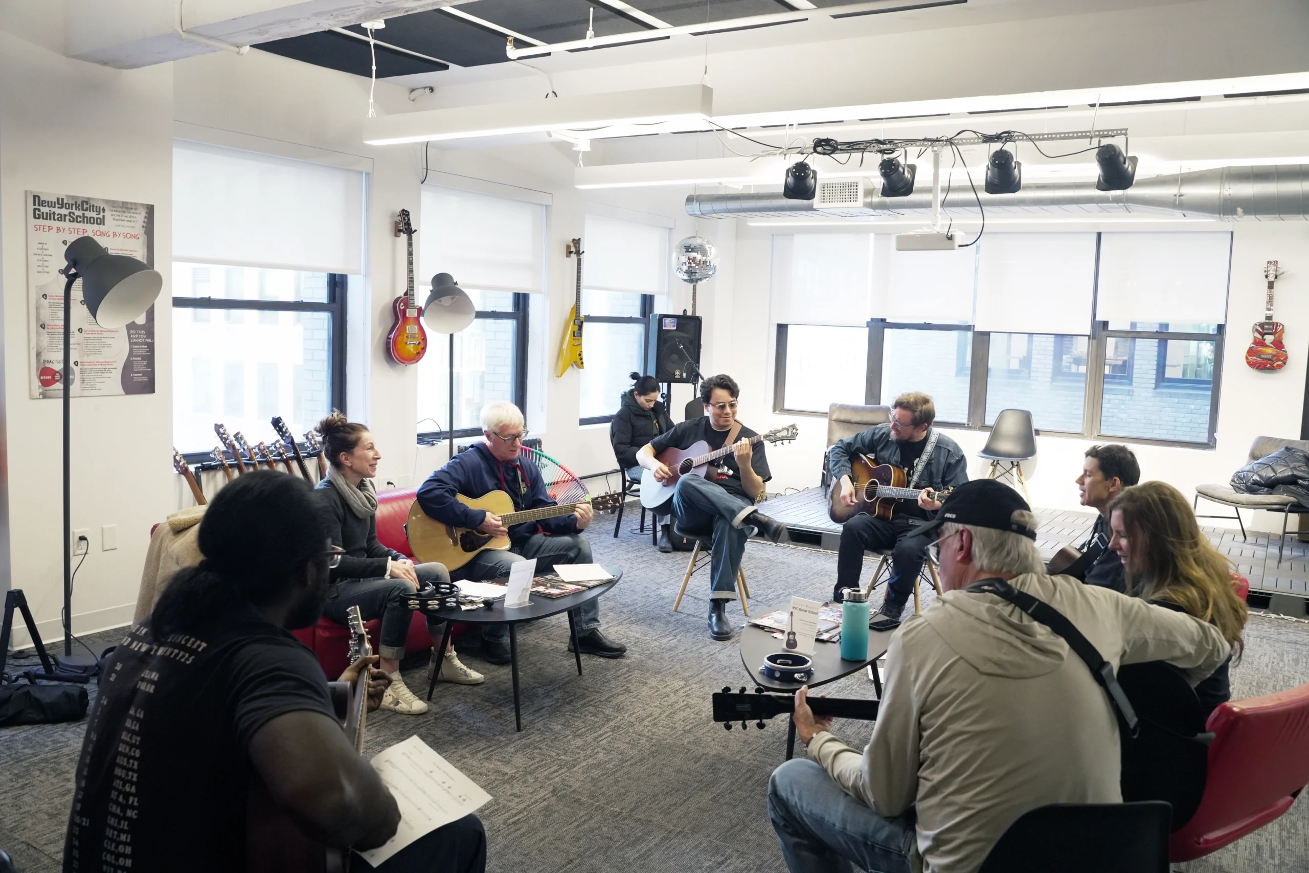 Guests learning guitar during Guitar Workshop and Busking Experience in NYC