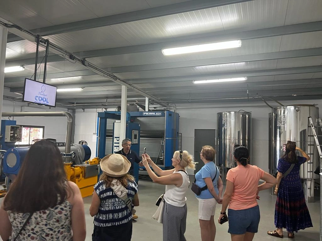 Guests taking photos in processing plant