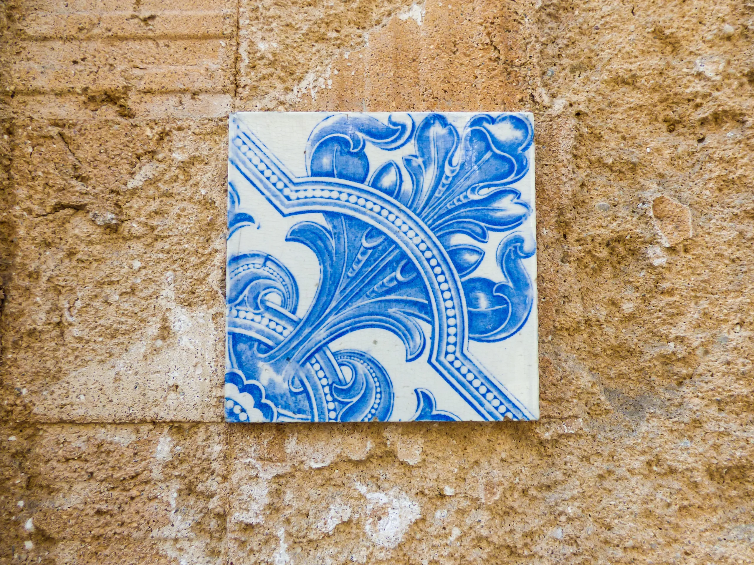One blue Portuguese tile laone on the wall in Lisbon