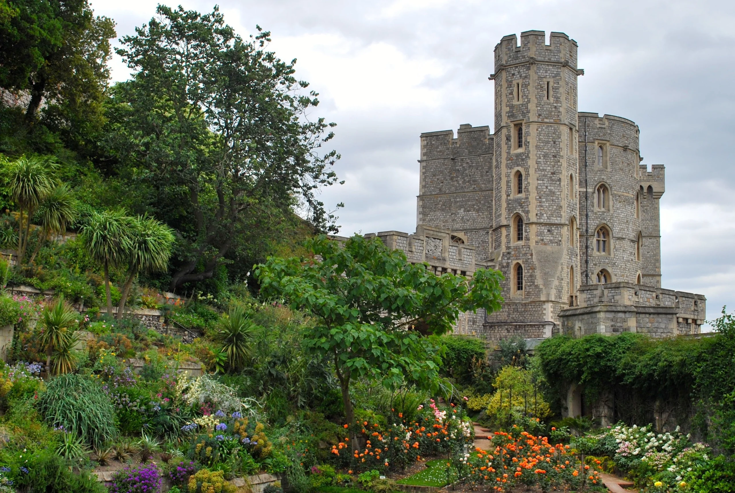 Gardens and view of tower of Windsor Castle in UK
