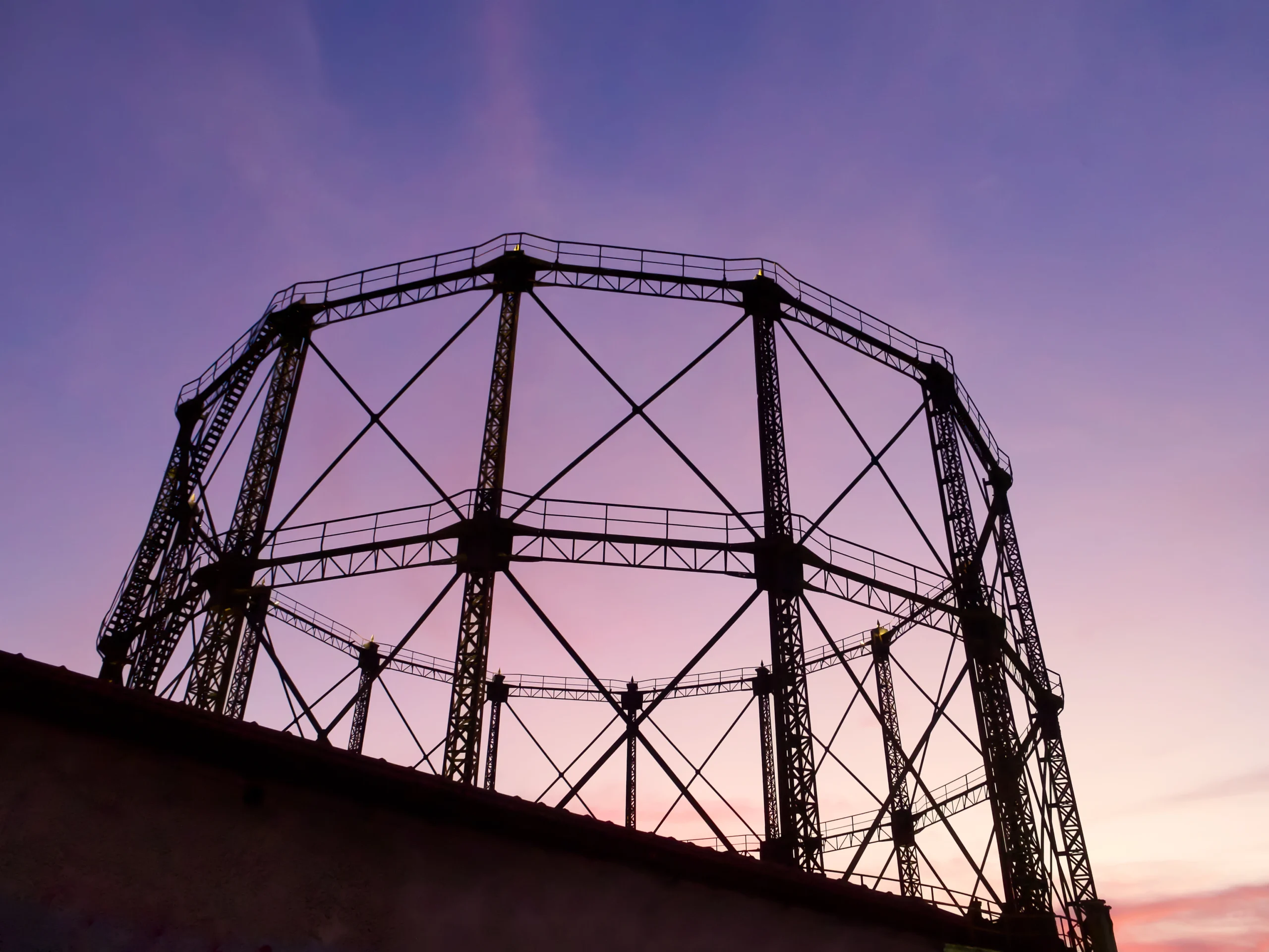 Gas tank in abandoned factory in sunset colours during premium Urban Art Insider experience