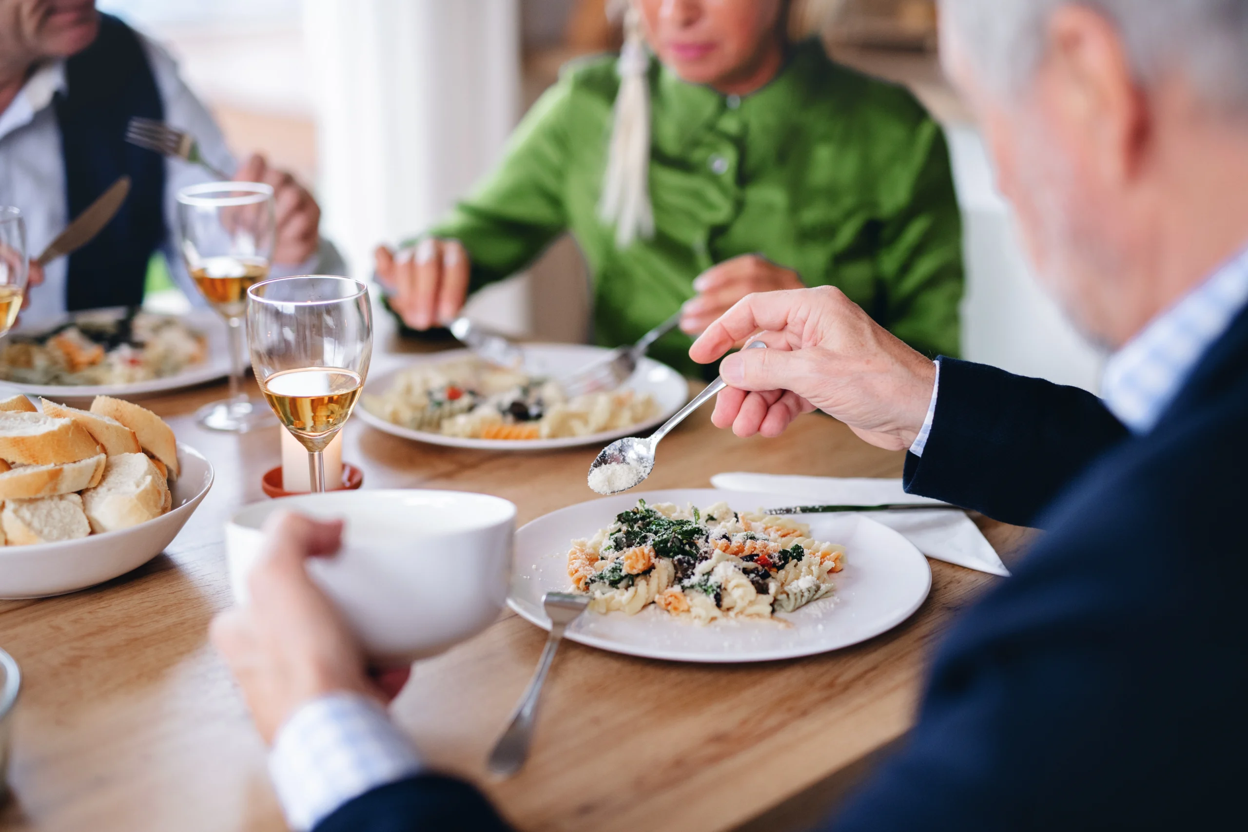 Group of friends eating at the dinner table during Dinner Party and Cooking Class with an Athenian Chef