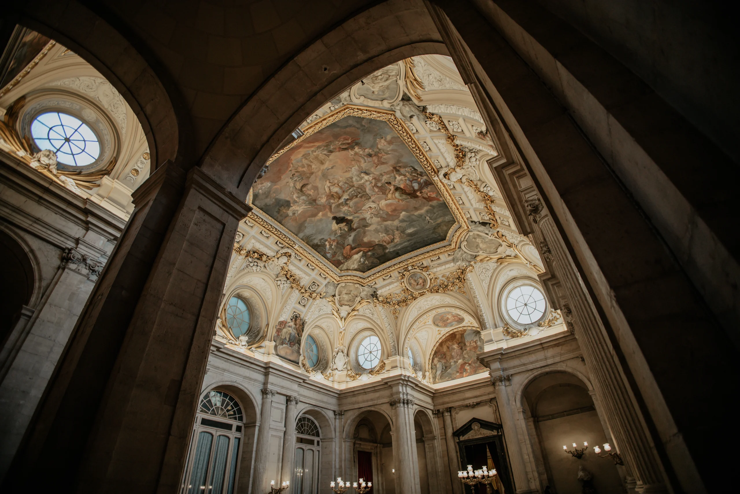 Low angle shot of the ornamented ceiling of the Royal Palace in Madrid during Prado Museum & Royal Palace With a Historian experience