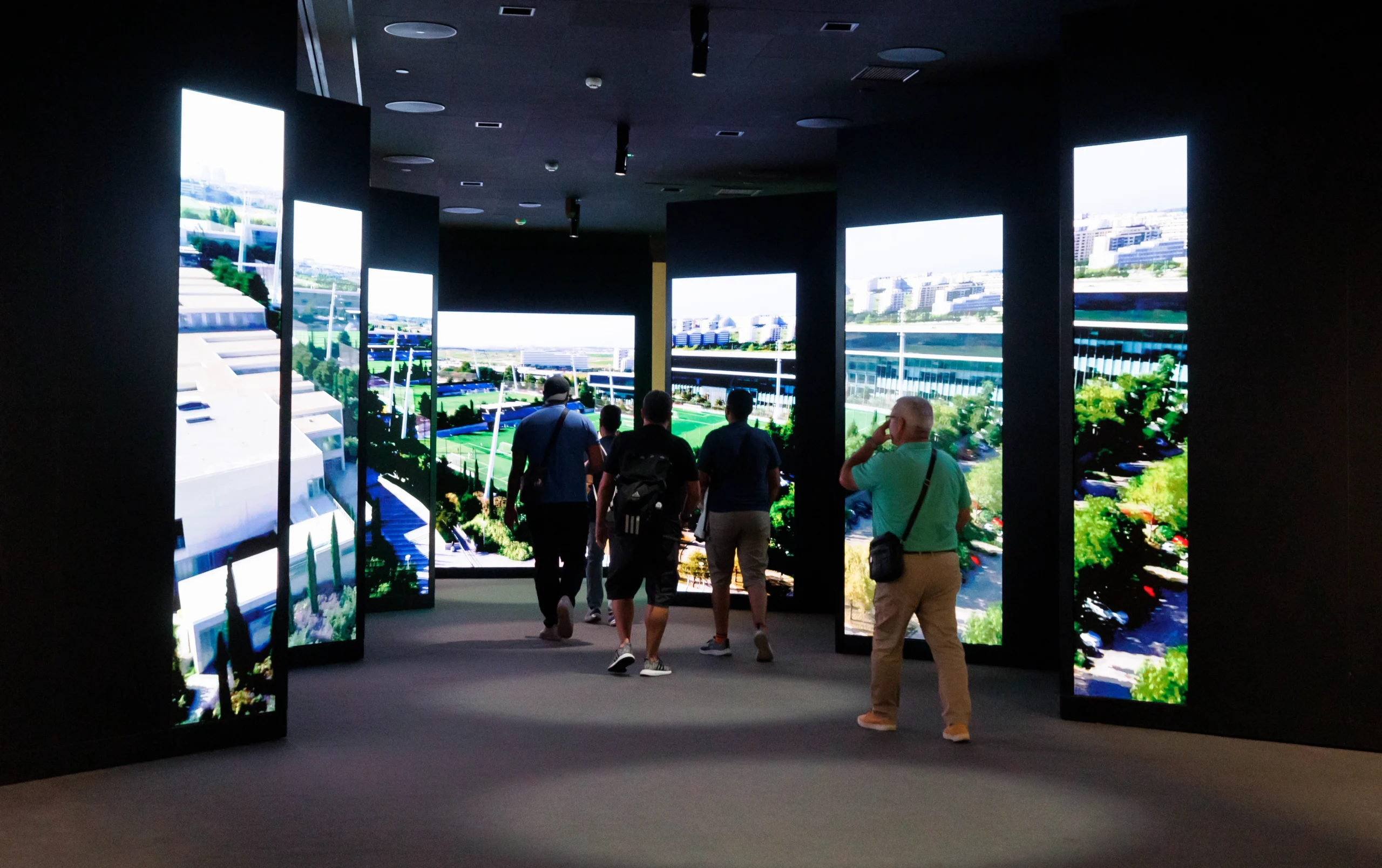 People in immersive walkthrough display during Bernabéu Megafan Stadium Experience