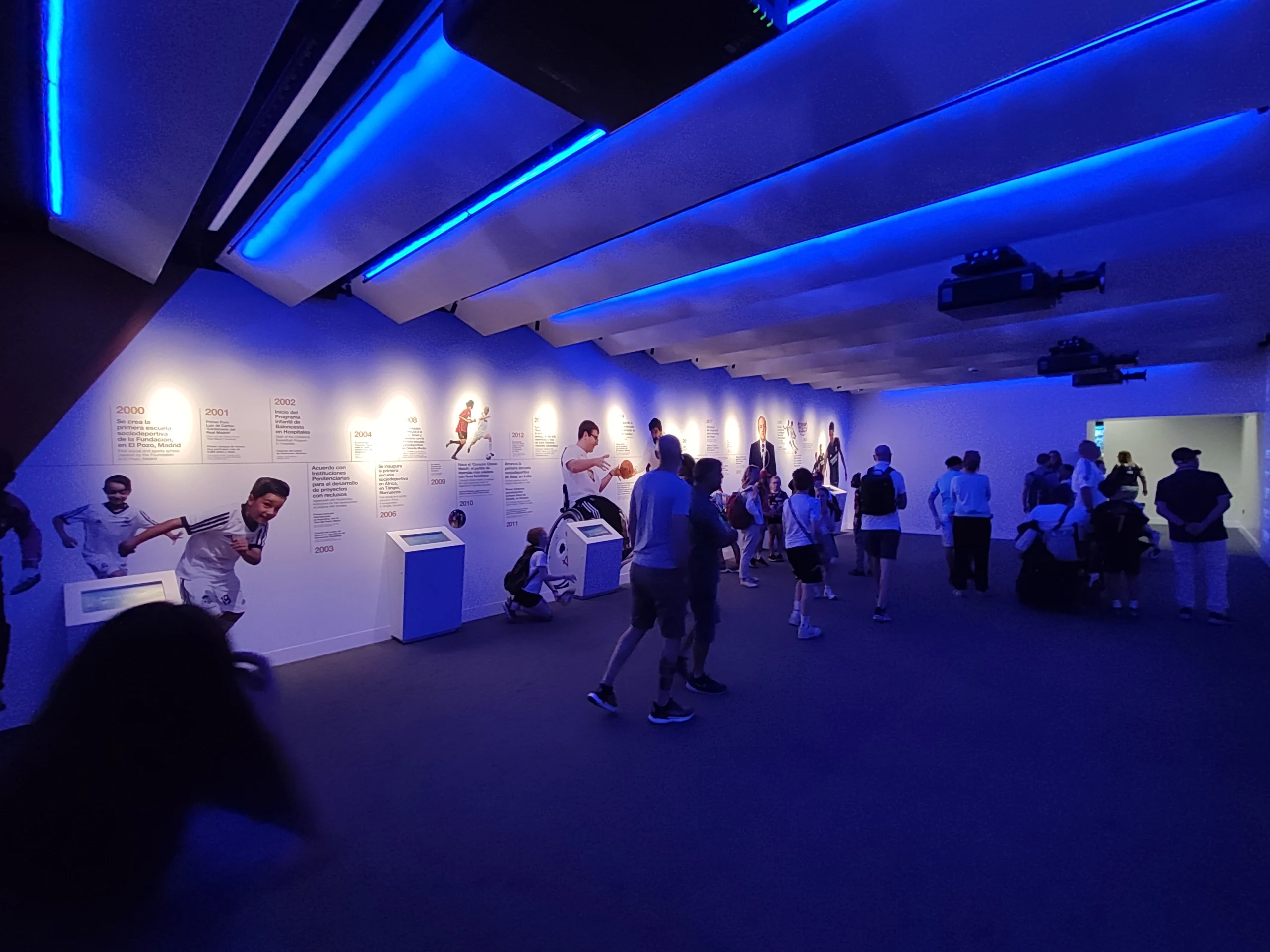 People walking through Foundation Real Madrid room during Bernabéu Megafan Stadium Experience
