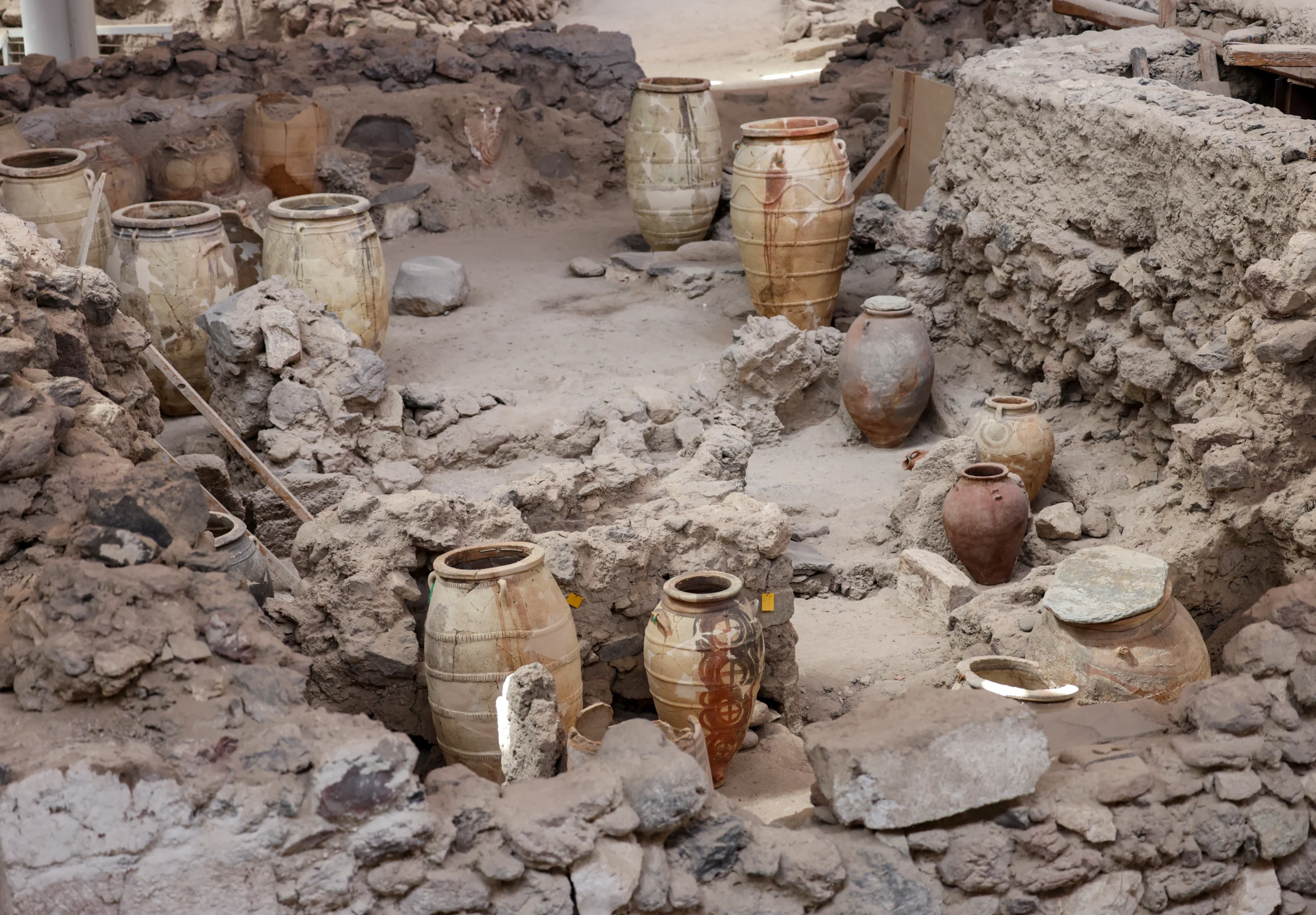 Recovered ancient pottery in prehistoric town of Akrotiri, excavation site during private Santorini experience