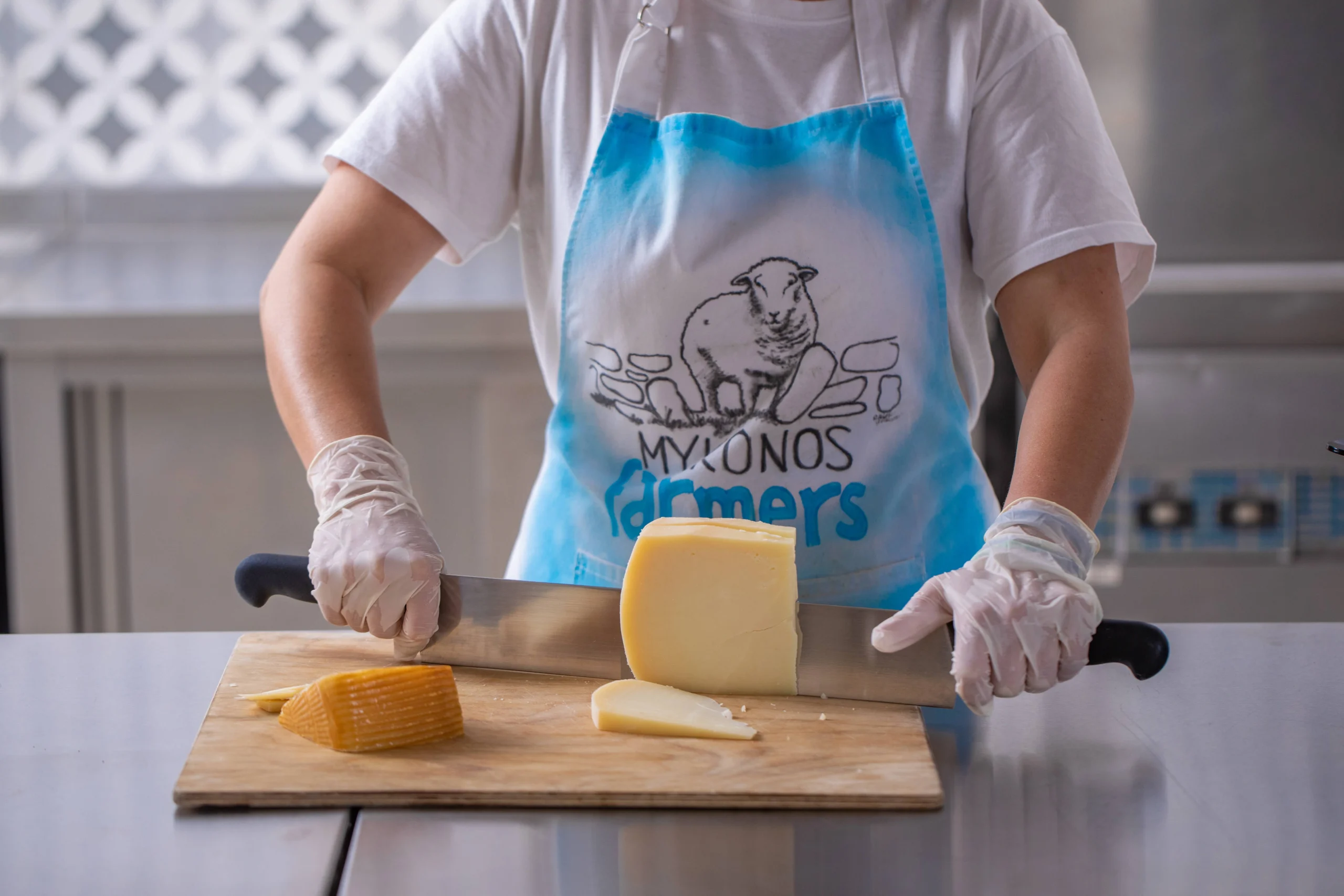Slicing cheese during Cheese Farm experience