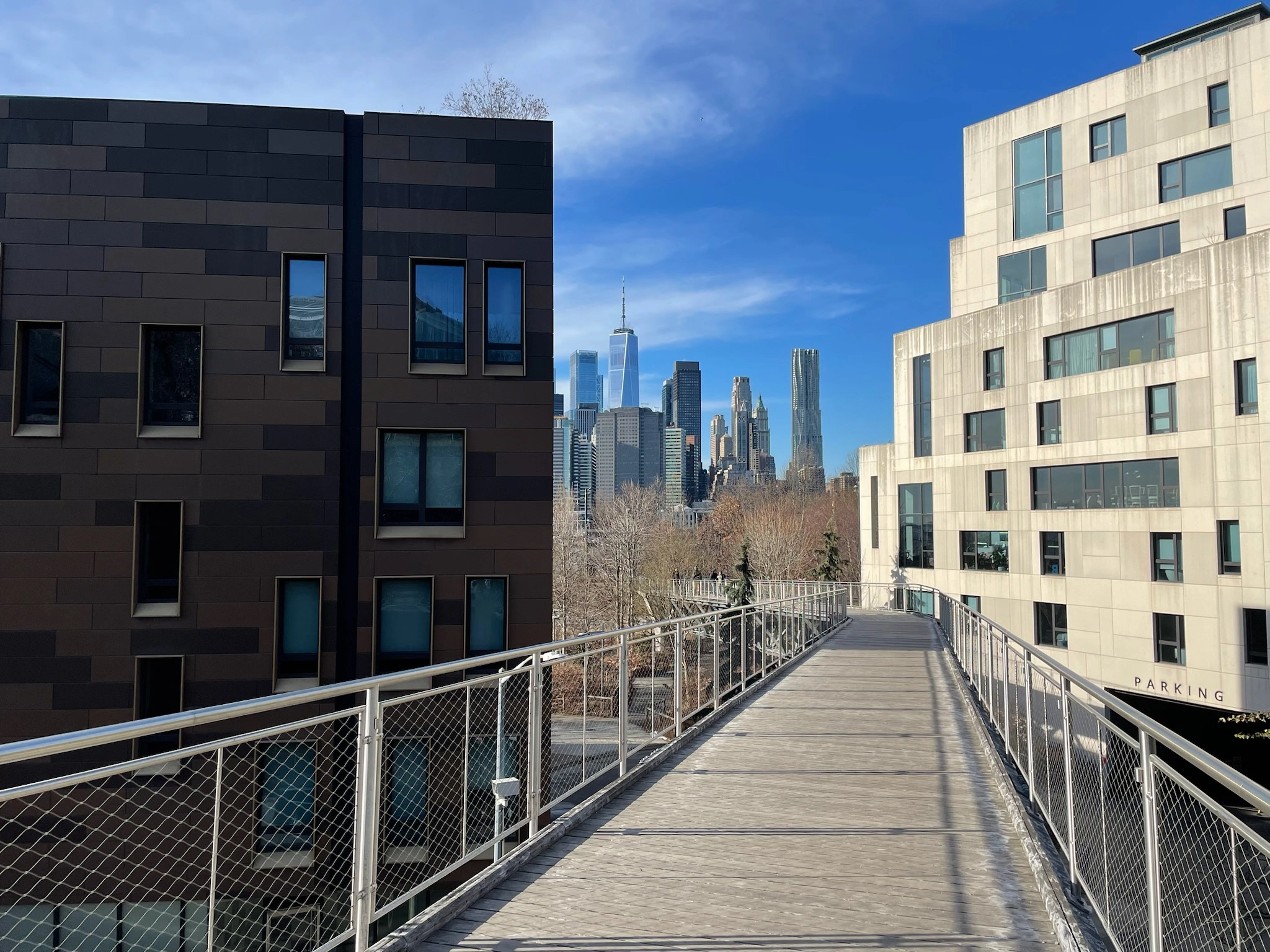 Walkway with New York City landscape peeking through the back