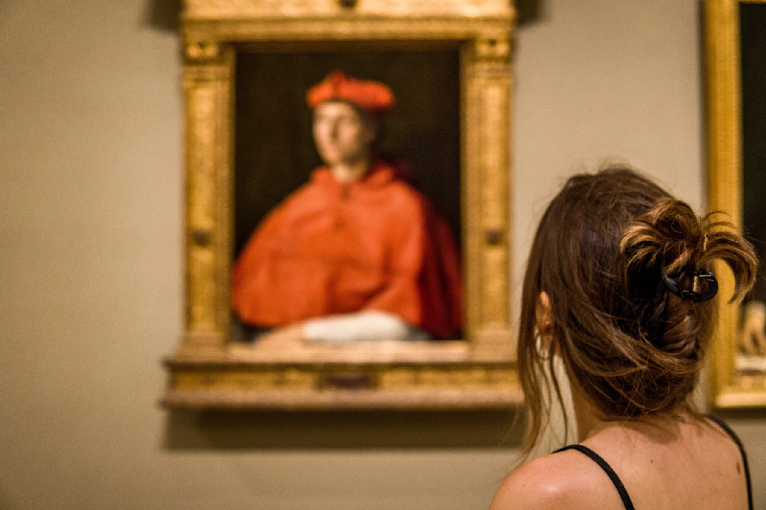 Woman admiring medieval painting in Prado Museum in Madrid during Prado Museum & Royal Palace With a Historian experience
