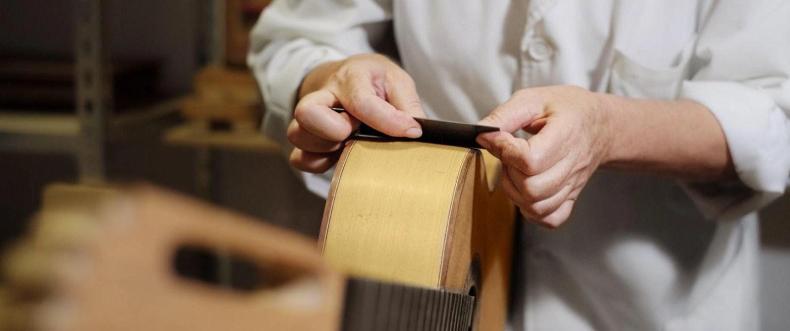 Close up of hands and guitar