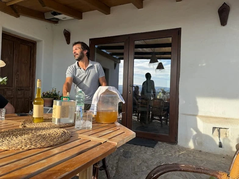 Host explaining olive oil during private experience in Granada