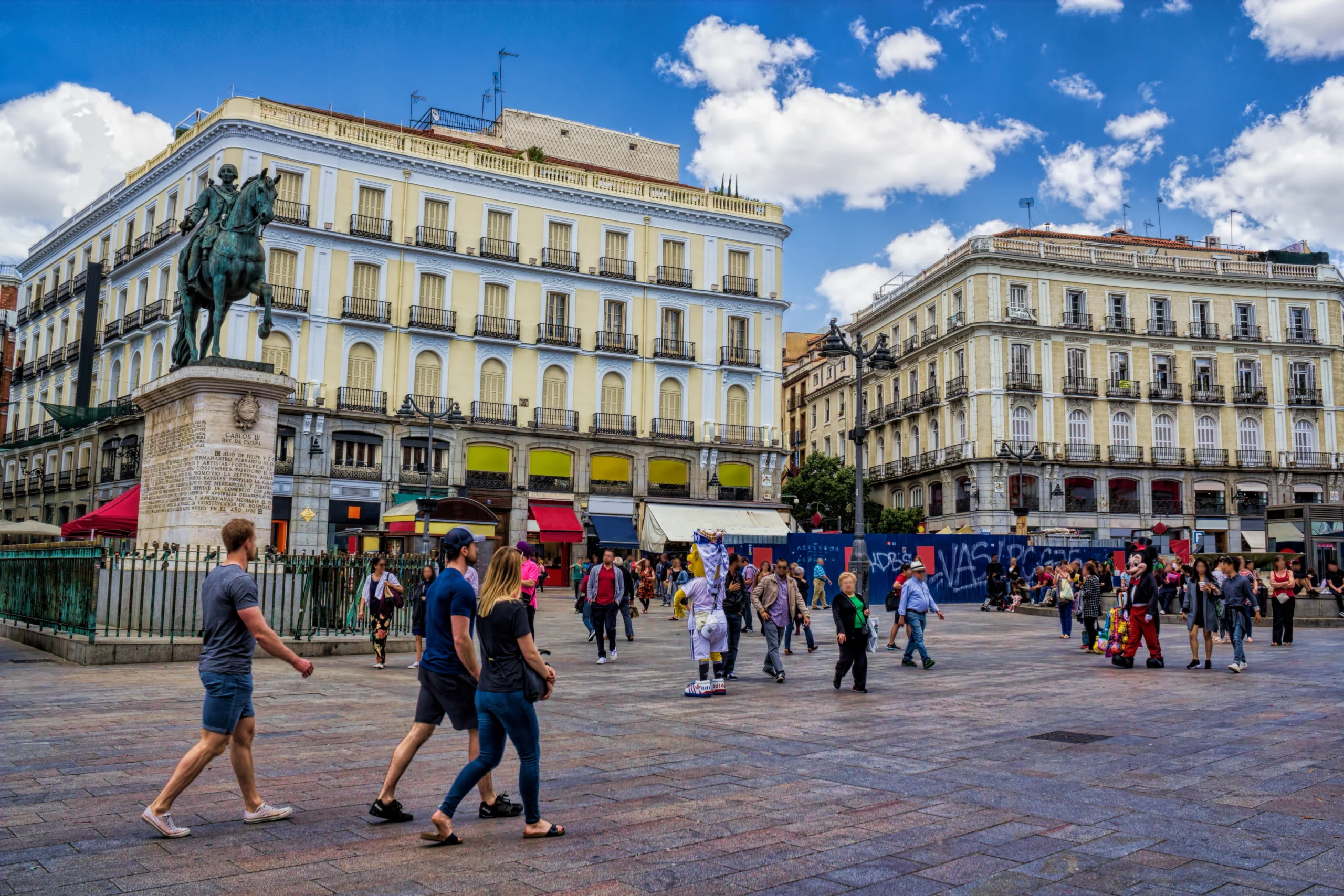 View of people walking through Puerta del Sol in Madrid